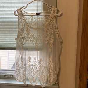 See through white lacy tank. Torrid.